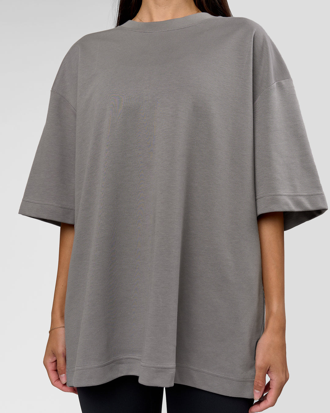 Woman wearing AfterDark ZeroCrease Oversized Tee - Storm Front | Model:Rhylee | Size:XS