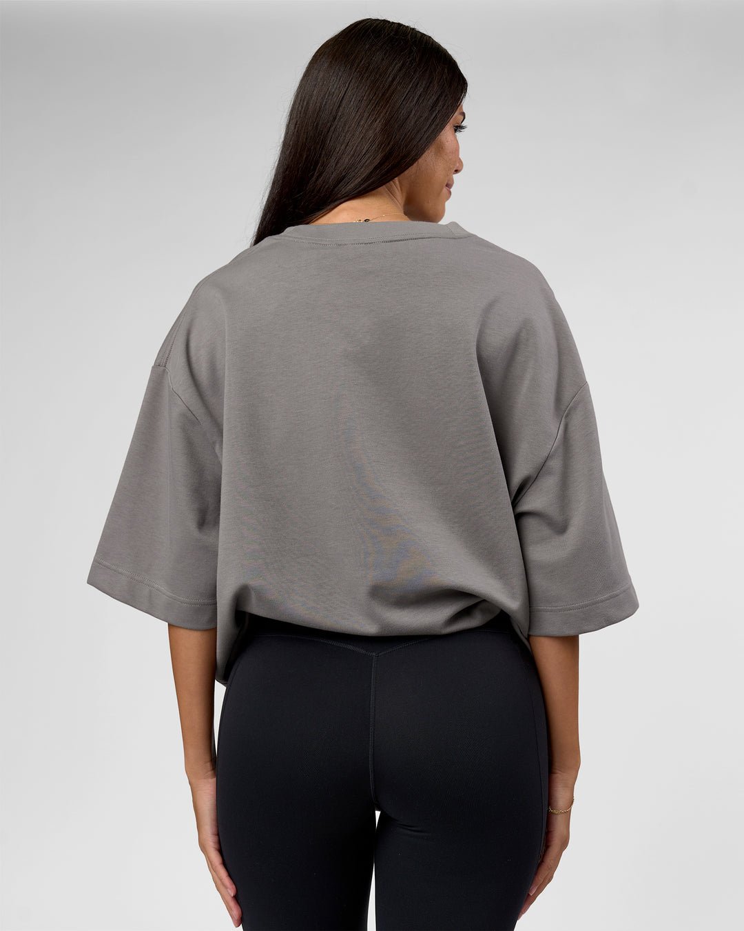 Woman wearing AfterDark ZeroCrease Oversized Tee - Storm Front | Model:Rhylee | Size:XS