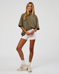Woman wearing AfterDark ZeroCrease Oversized Tee - Walnut Grey | Model:Georgia | Size:XS