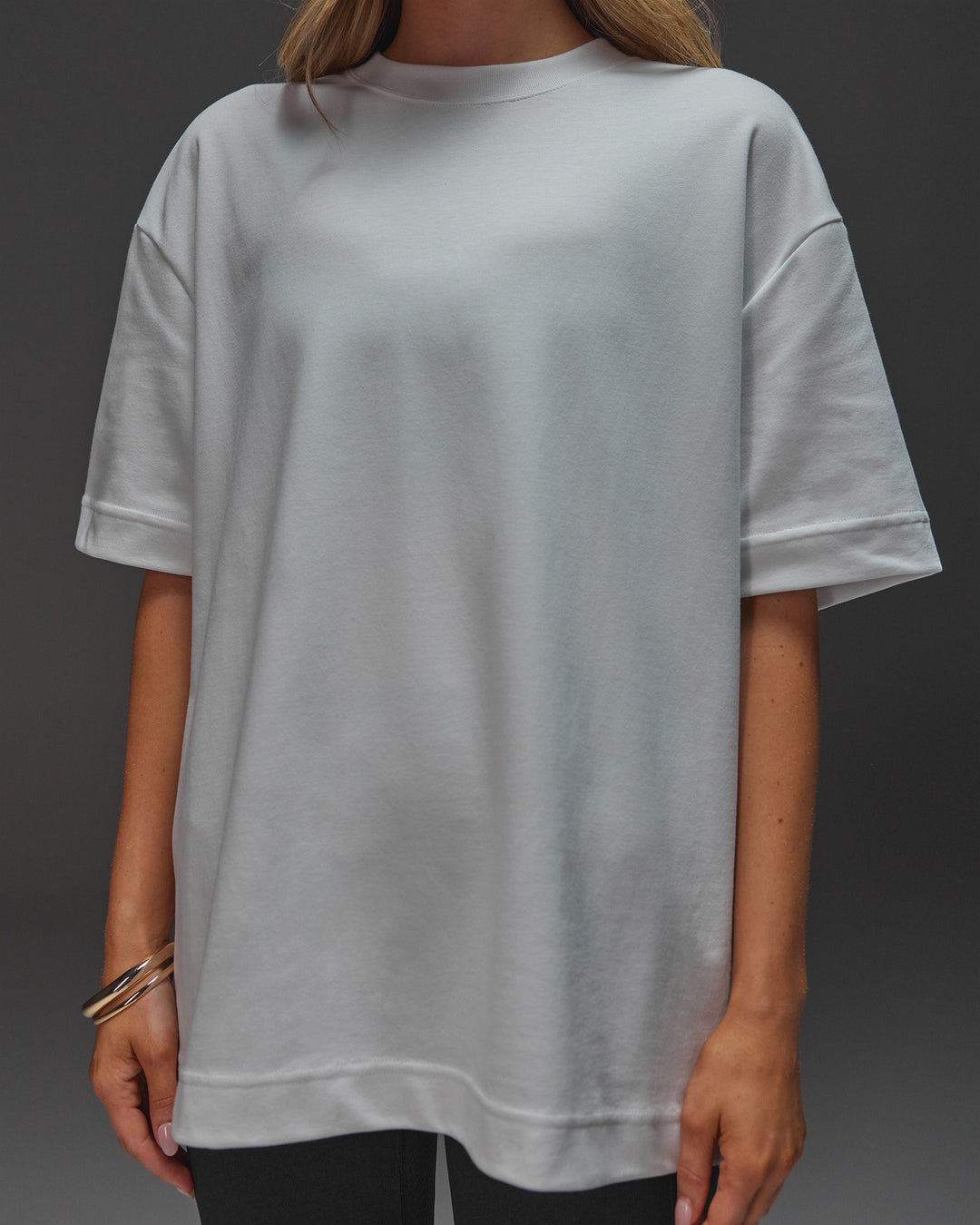 Woman wearing AfterDark ZeroCrease Oversized Tee - White | Model:Leilani | Size:XS
