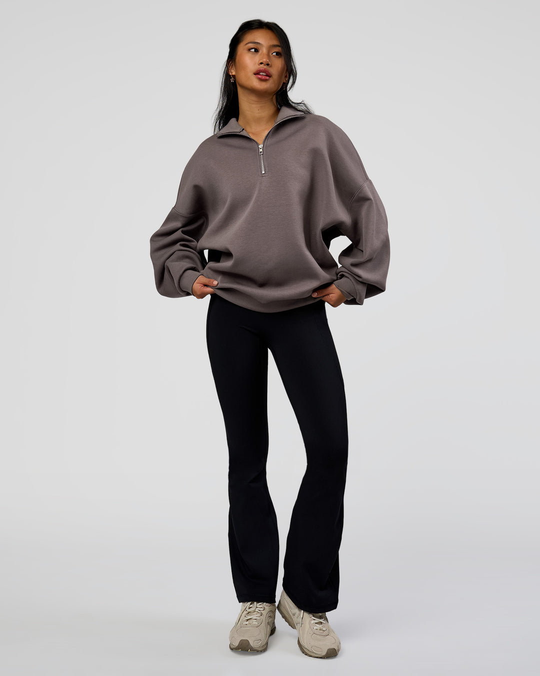 Woman wearing AfterDark ZeroCrease Quarter Zip - Duskstone | Model:Loren | Size:XS