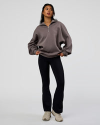 Woman wearing AfterDark ZeroCrease Quarter Zip - Duskstone | Model:Loren | Size:XS