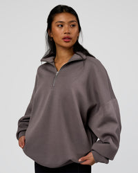 Woman wearing AfterDark ZeroCrease Quarter Zip - Duskstone | Model:Loren | Size:XS