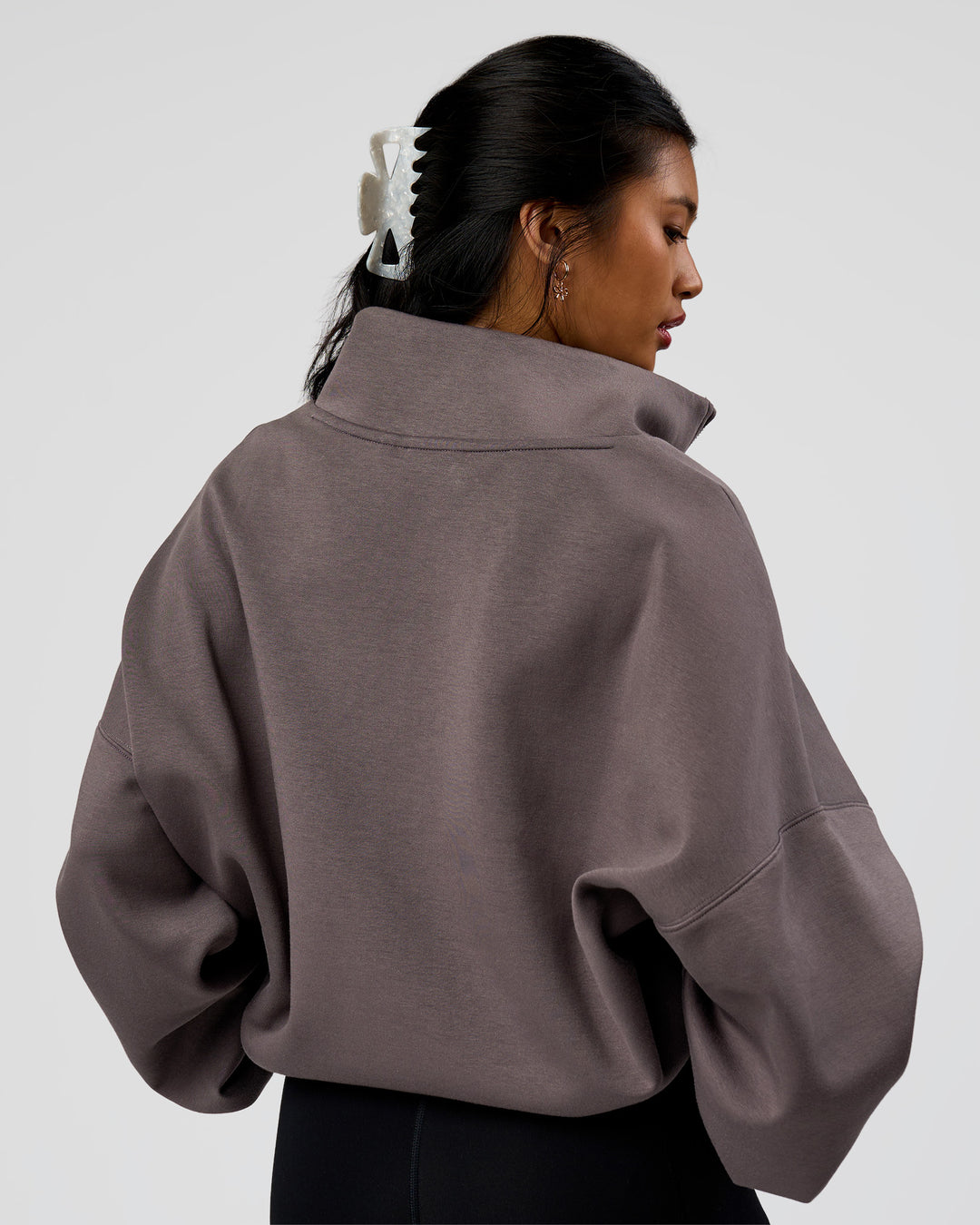 Woman wearing AfterDark ZeroCrease Quarter Zip - Duskstone | Model:Loren | Size:XS