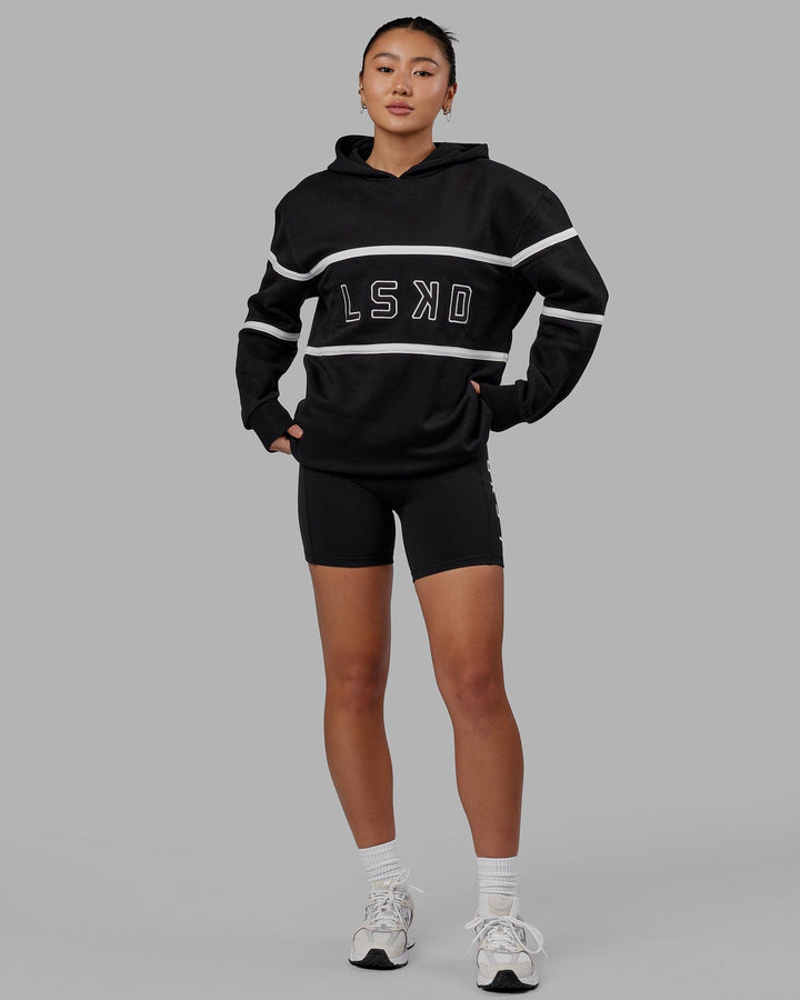 Woman wearing Unisex Aligned Hoodie Oversize - Black