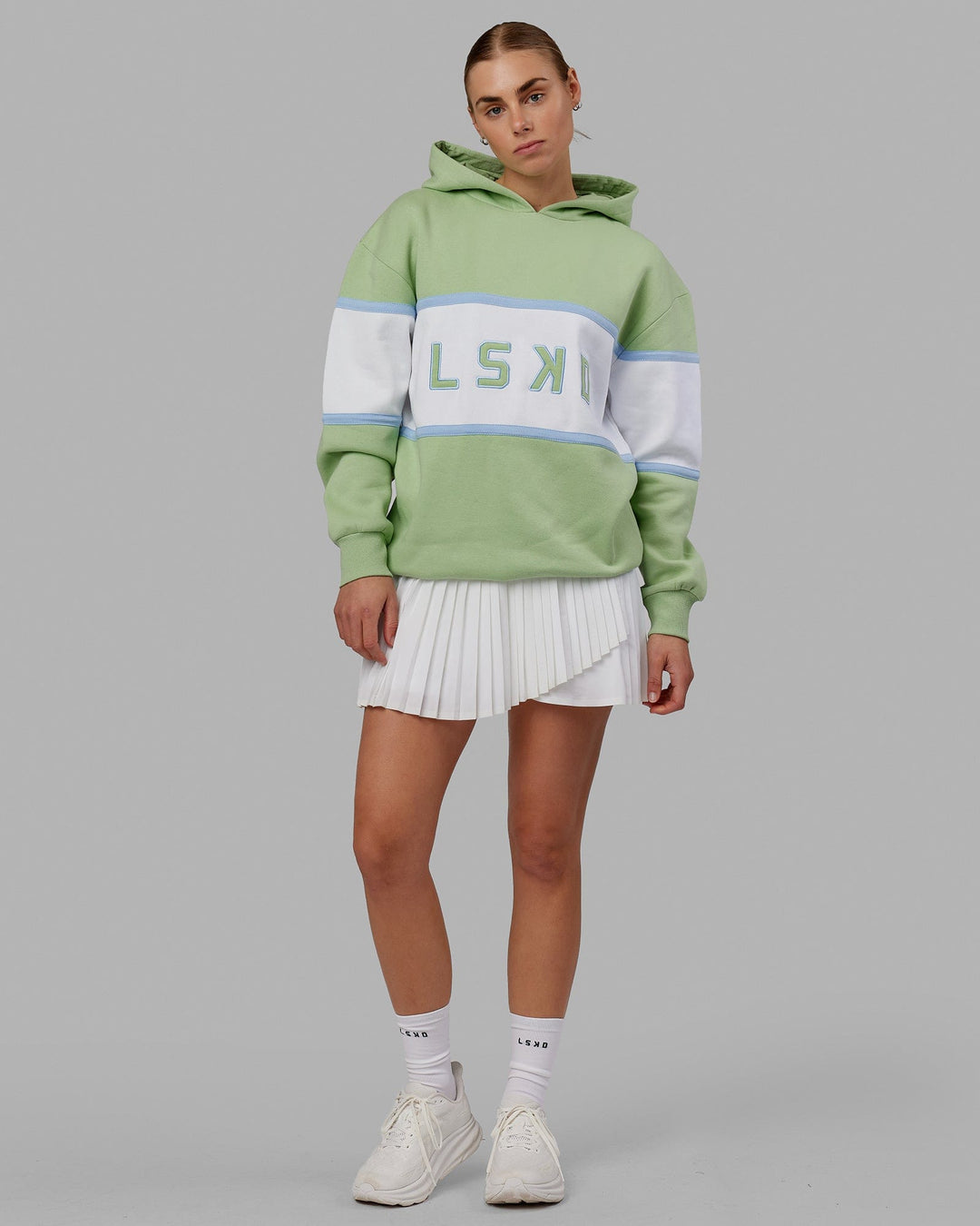 Woman wearing Unisex Aligned Hoodie Oversize - Green Fig