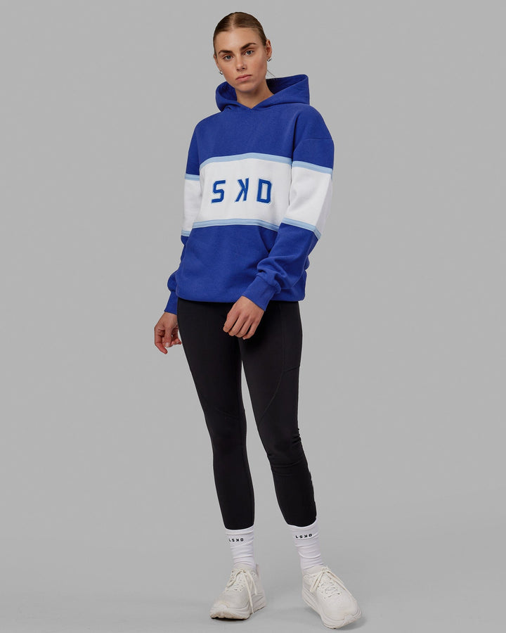 Woman wearing Unisex Aligned Hoodie Oversize - Power Cobalt