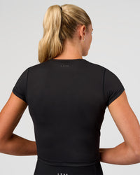 Woman wearing All Day Short Sleeve Tee - Black | Model:Emelia | Size:XS