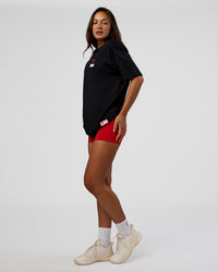 Woman wearing Archive FLXCotton Oversized Tee - Black-Scarlet | Model:Kirstyn | Size:XS