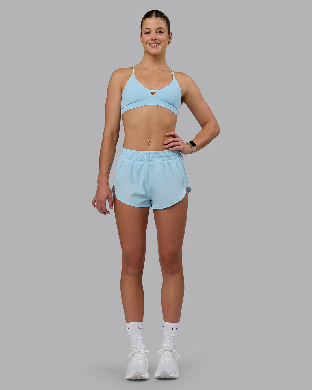 Woman wearing Ascend Sports Bra - Crystal Blue