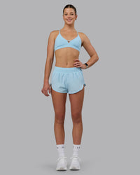 Woman wearing Ascend Sports Bra - Crystal Blue