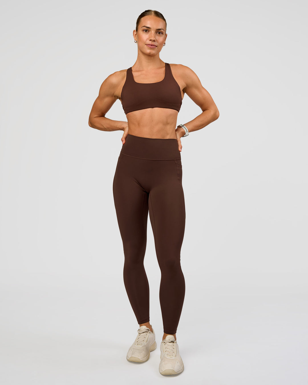 Woman wearing Aspire Sports Bra - Hot Chocolate | Model:Maja | Size:XS