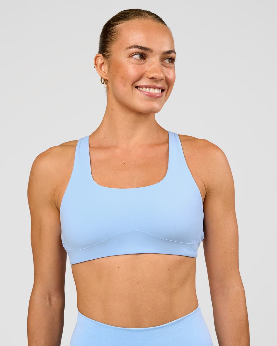 Woman wearing Aspire Sports Bra - Open Air | Model:Maja | Size:XS