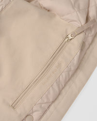 Woman wearing Auxiliary 2.0 Jacket - Shale Beige | Model:Brylee | Size:XS