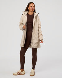 Woman wearing Auxiliary 2.0 Longline Jacket - Shale Beige | Model:Brylee | Size:XS