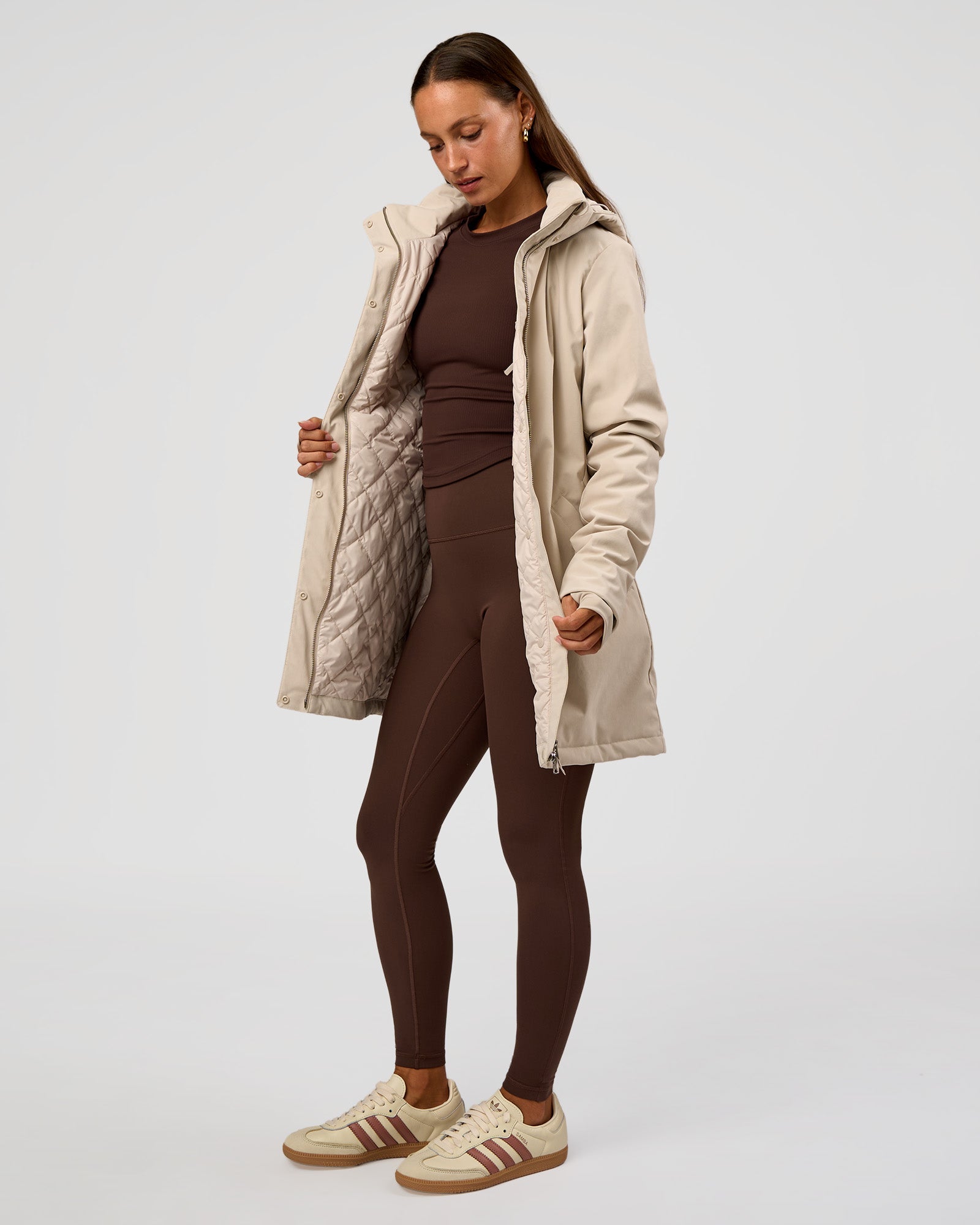 Woman wearing Auxiliary 2.0 Longline Jacket - Shale Beige | Model:Brylee | Size:XS