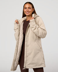 Woman wearing Auxiliary 2.0 Longline Jacket - Shale Beige | Model:Brylee | Size:XS