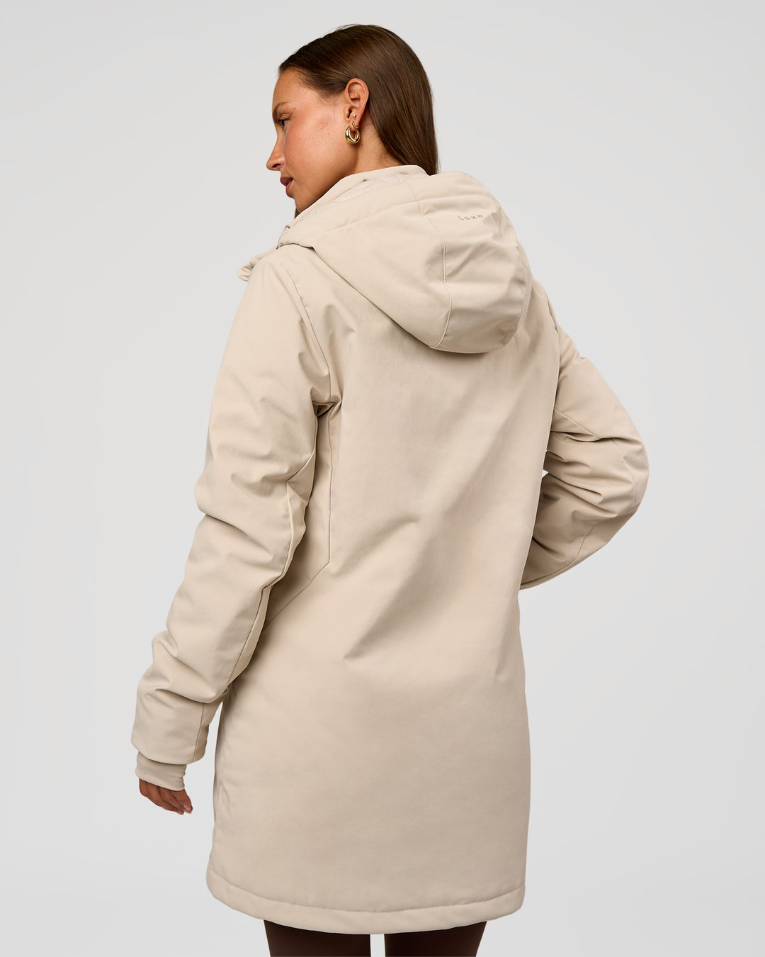 Woman wearing Auxiliary 2.0 Longline Jacket - Shale Beige | Model:Brylee | Size:XS