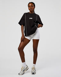 Woman wearing Axis Heavyweight Oversized Boxed Tee - Black-White | Model:Ellie | Size:XS