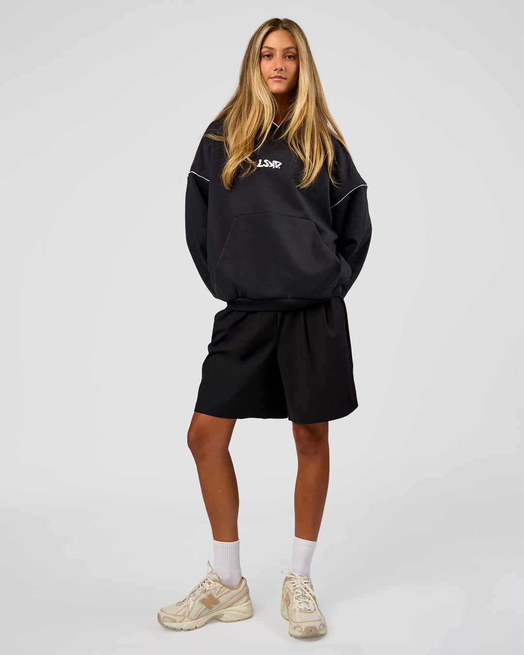 Woman wearing Axis Oversized Hoodie - Caviar-White | Model:Georgia | Size:XS