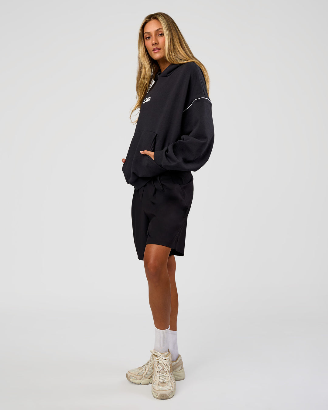 Woman wearing Axis Oversized Hoodie - Caviar-White | Model:Georgia | Size:XS