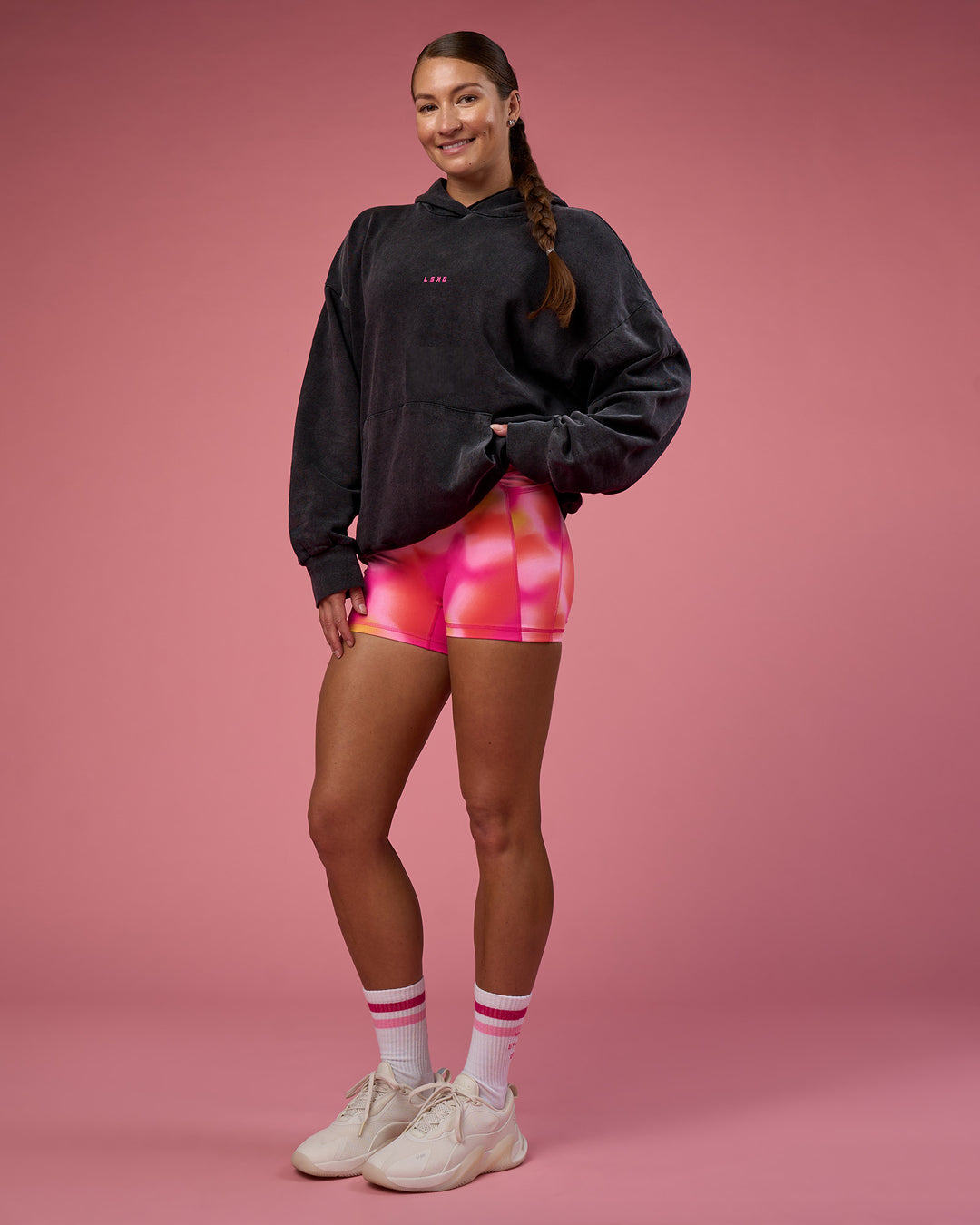 Woman wearing BCAM Washed Unisex Oversized Hoodie - Black Washed-Pink | Model:Hannah | Size:XS