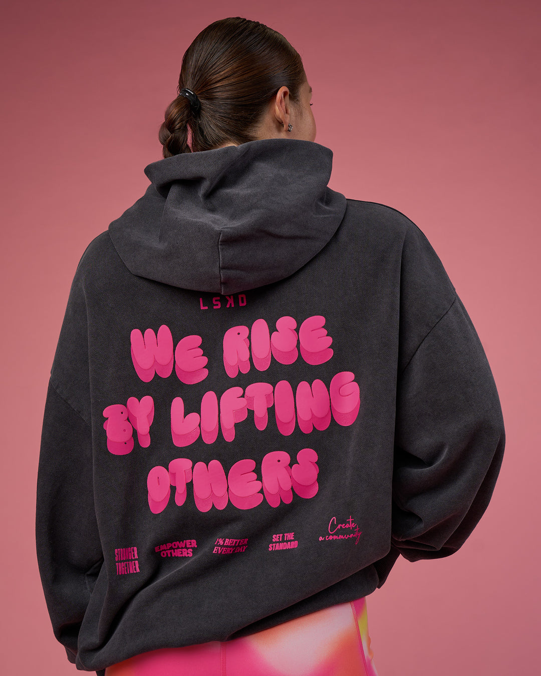 Woman wearing BCAM Washed Unisex Oversized Hoodie - Black Washed-Pink | Model:Hannah | Size:XS