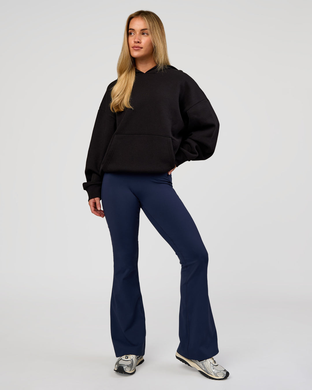 Woman wearing Base Oversized Hoodie - Black | Model:Issy | Size:XS |