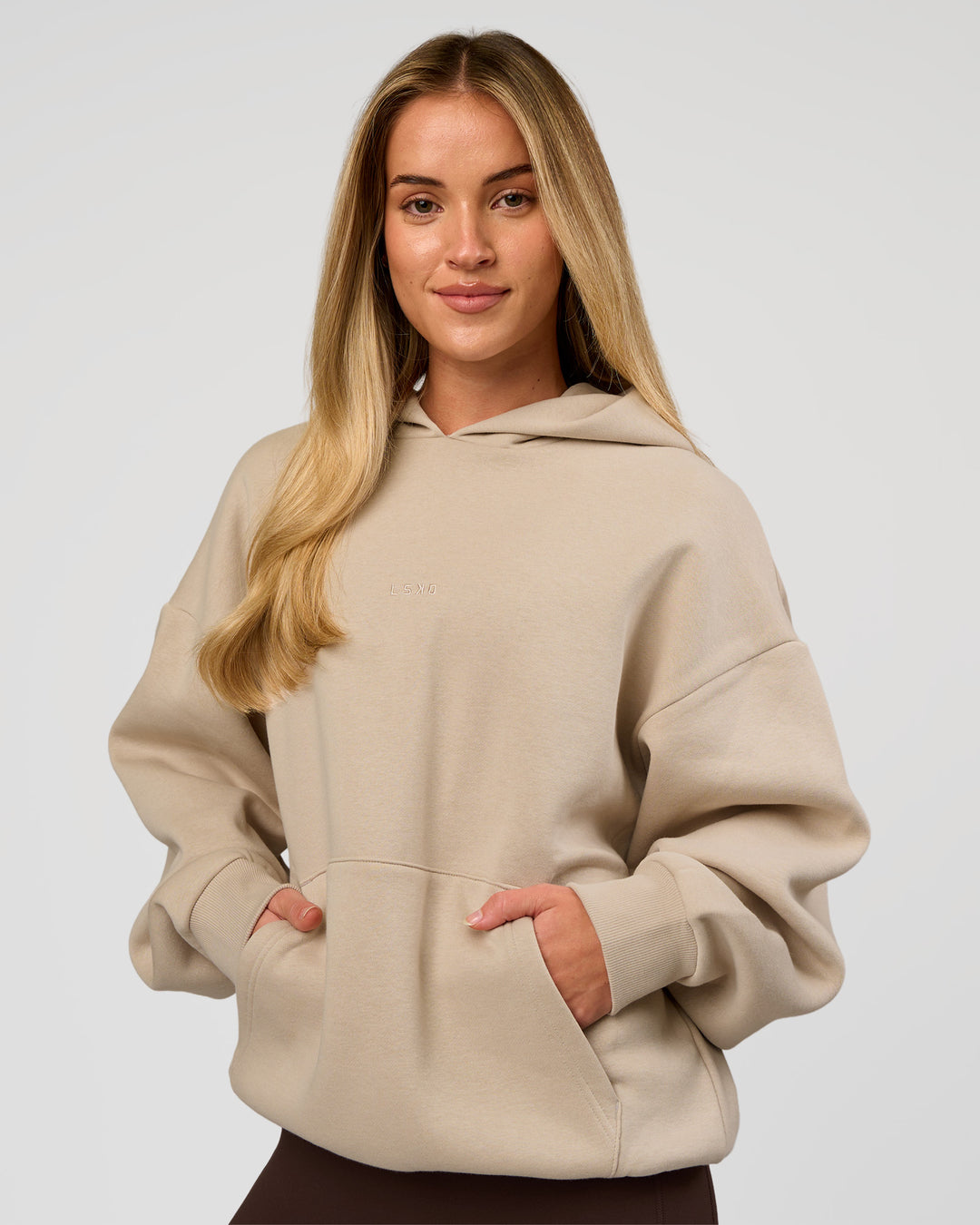 Woman wearing Base Oversized Hoodie - Shale Beige | Model:Issy | Size: XS |
