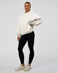 Woman wearing Base Oversized Hoodie - Silver Marl | Model:Maja | Size:XS