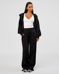 Woman wearing Base Zip Through Oversized Hoodie - Black | Model:Brylee | Size:XS