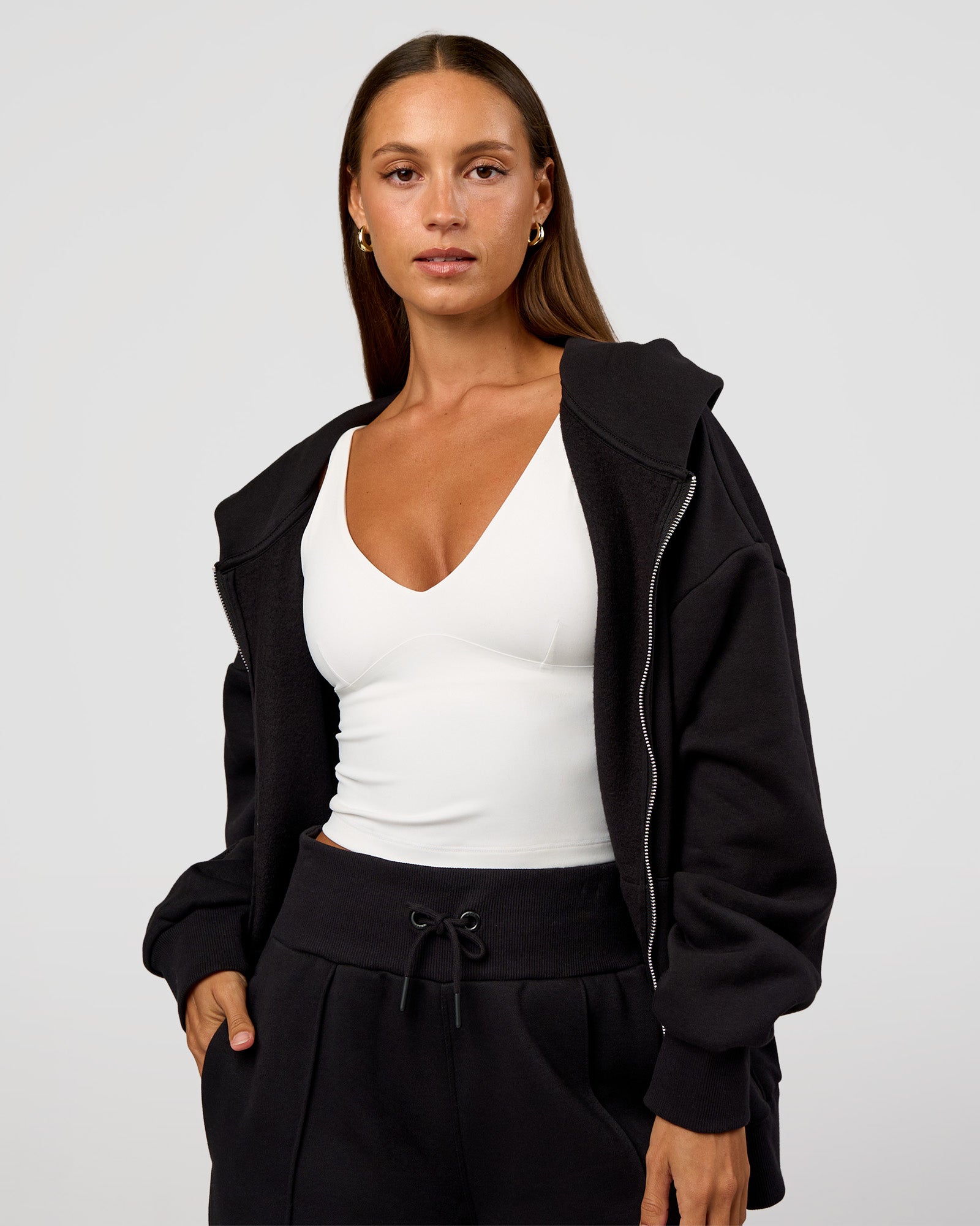 Woman wearing Base Zip Through Oversized Hoodie - Black | Model:Brylee | Size:XS