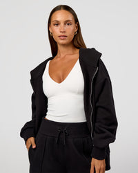 Woman wearing Base Zip Through Oversized Hoodie - Black | Model:Brylee | Size:XS