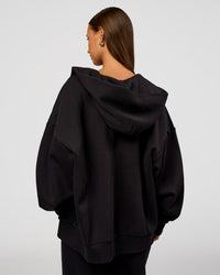 Woman wearing Base Zip Through Oversized Hoodie - Black | Model:Brylee | Size:XS