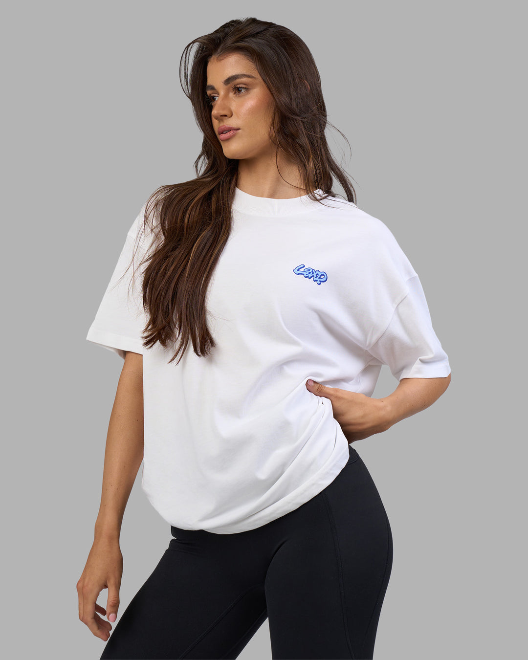 Woman wearing Break Through Heavyweight Oversized Tee - White-Power Cobalt | Model:Phoebe | Size:XS