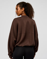 Woman wearing CF Elevate SoftTouch Bomber - Hot Chocolate | Model:Jordan | Size:XS