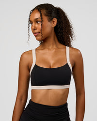 Woman wearing CF Move Through It Sports Bra - Black-Clay | Model:Jordan | Size:XS