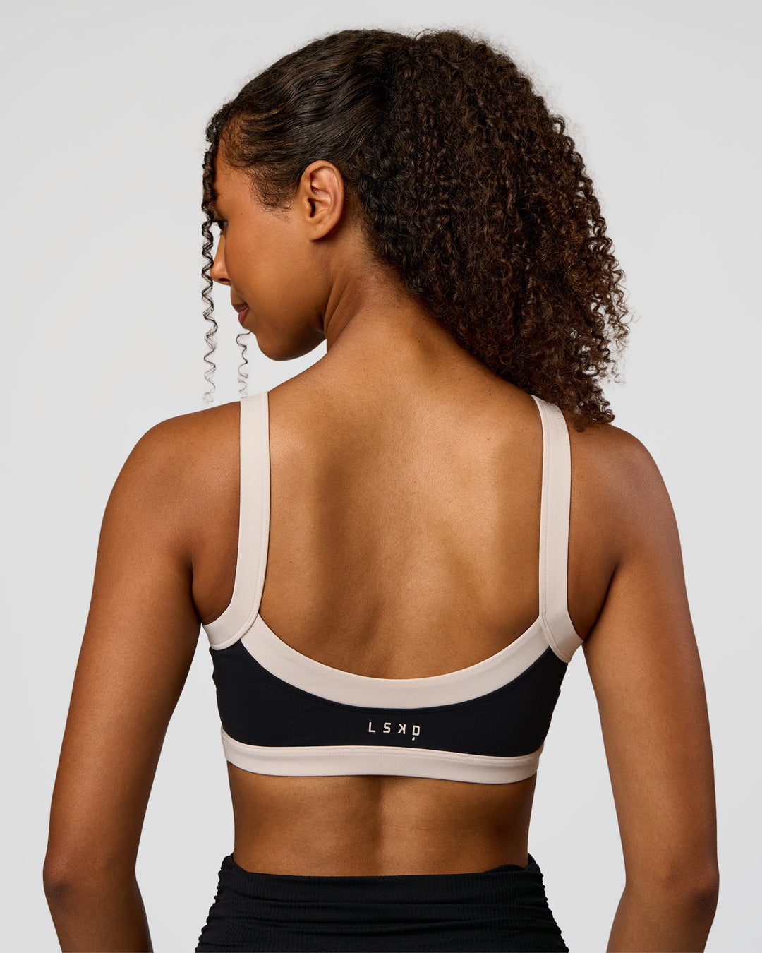 Woman wearing CF Move Through It Sports Bra - Black-Clay | Model:Jordan | Size:XS