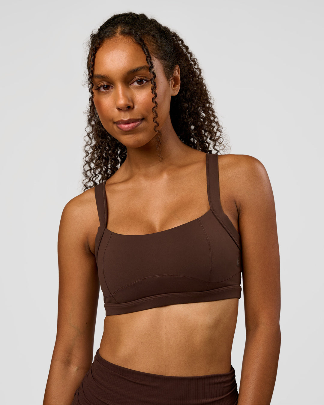 Woman wearing CF Move Through It Sports Bra - Hot Chocolate | Model:Jordan | Size:XS