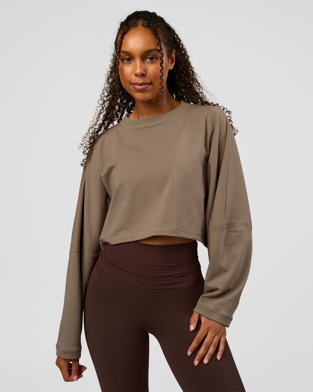 Woman wearing CF Street Surge Long Sleeve Tee - Taupe Ash | Model:Jordan | Size:XS - view 4