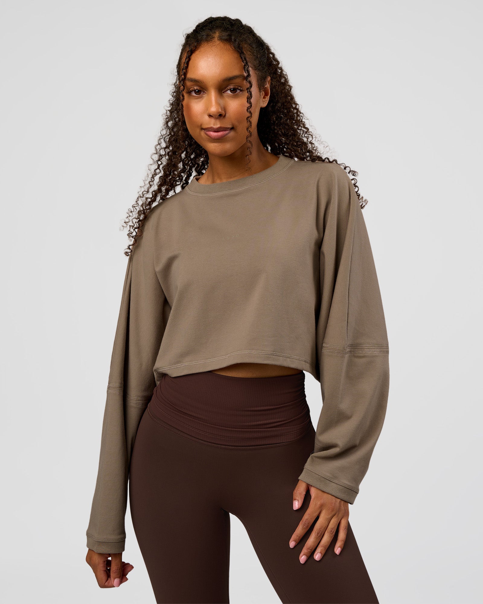 Woman wearing CF Street Surge Long Sleeve Tee - Taupe Ash | Model:Jordan | Size:XS