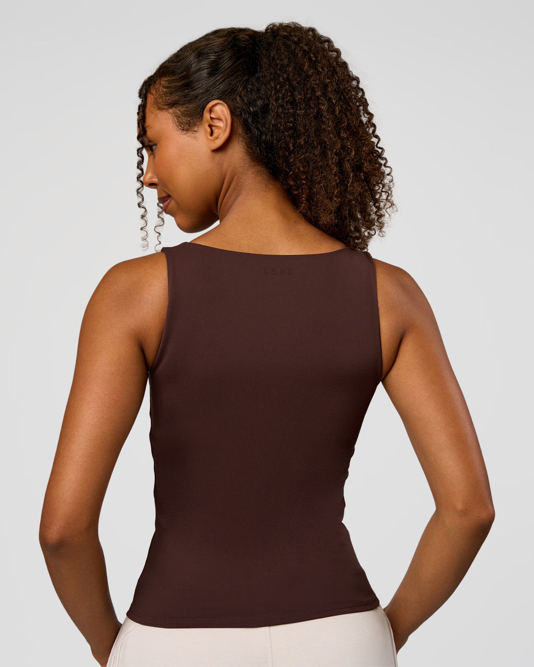 Woman wearing CF Train Hard Shelf Bra Tank - Hot Chocolate | Model:Jordan | Size:XS