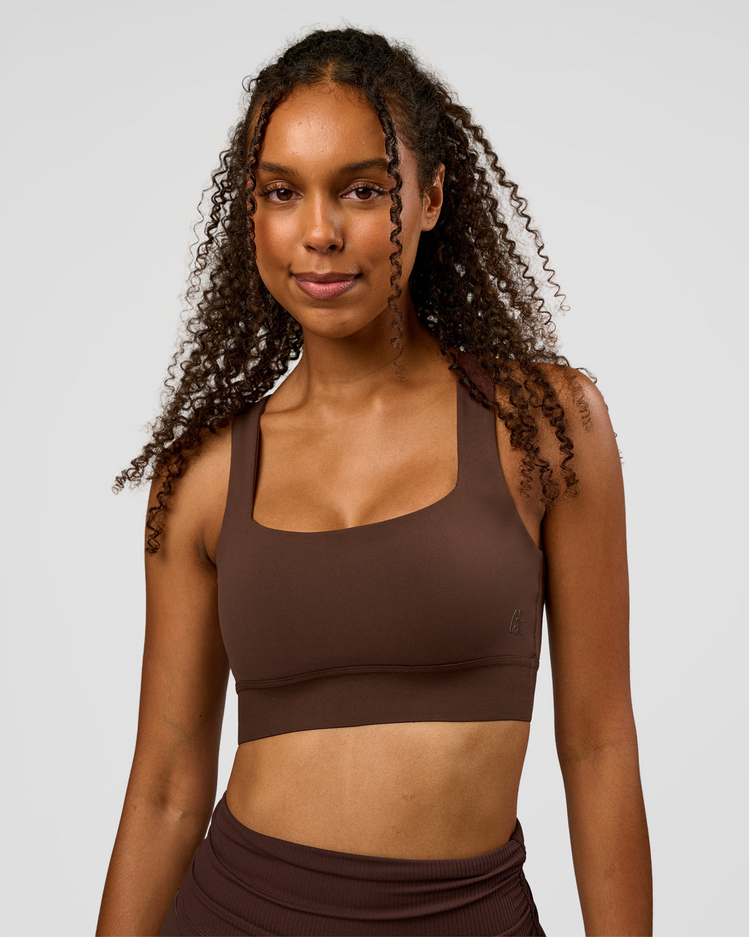 Woman wearing CF Train Hard Sports Bra - Hot Chocolate | Model:Jordan | Size:XS