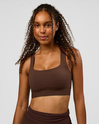Woman wearing CF Train Hard Sports Bra - Hot Chocolate | Model:Jordan | Size:XS