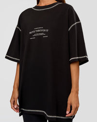 Woman wearing CF Unisex Oversized Heavyweight FLXCotton Tee - Black-CF Move Through It | Model:Brylee | Size:XS