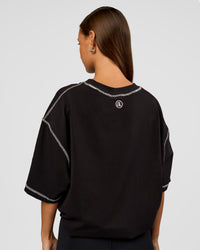 Woman wearing CF Unisex Oversized Heavyweight FLXCotton Tee - Black-CF Move Through It | Model:Brylee | Size:XS