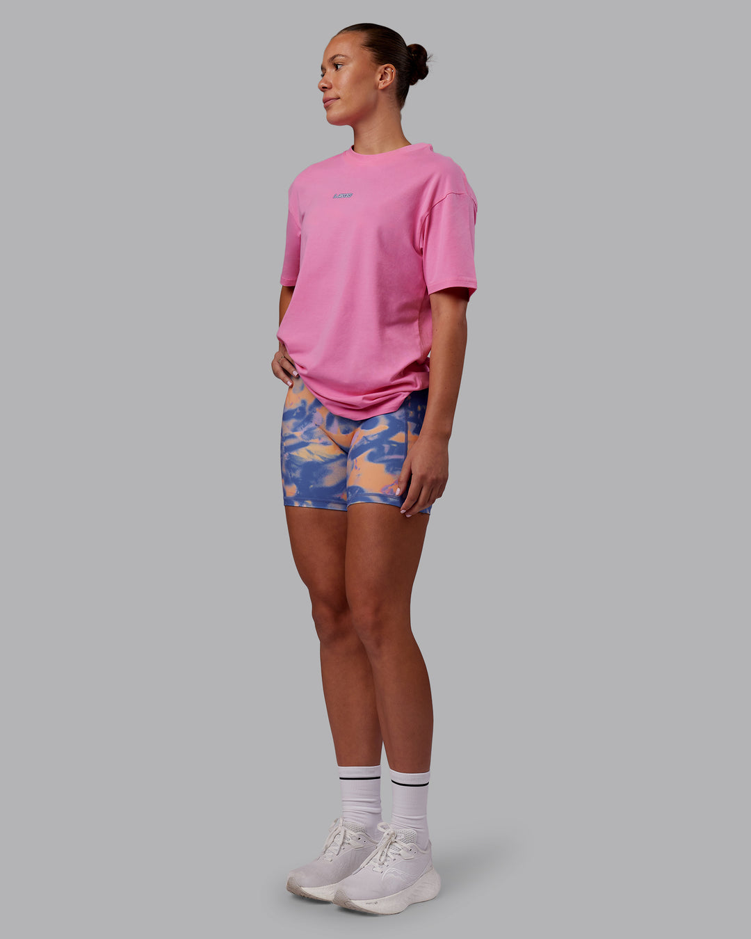 Woman wearing CFT BNE 25 FLXCotton Oversized Tee - Candy Pink-Purple Opulence | Model:Charlize | Size:XS