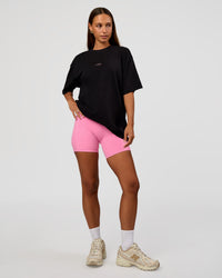 Woman wearing CFT BNE 26 FLXCotton Oversized Tee in Black | Model:Brylee | Size:XS
