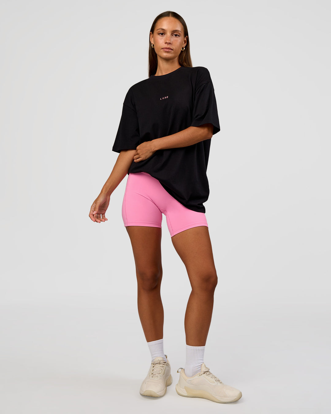 Woman wearing CFT BNE 26 FLXCotton Oversized Tee in Black | Model:Brylee | Size:XS