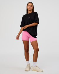Woman wearing CFT BNE 26 FLXCotton Oversized Tee in Black | Model:Brylee | Size:XS